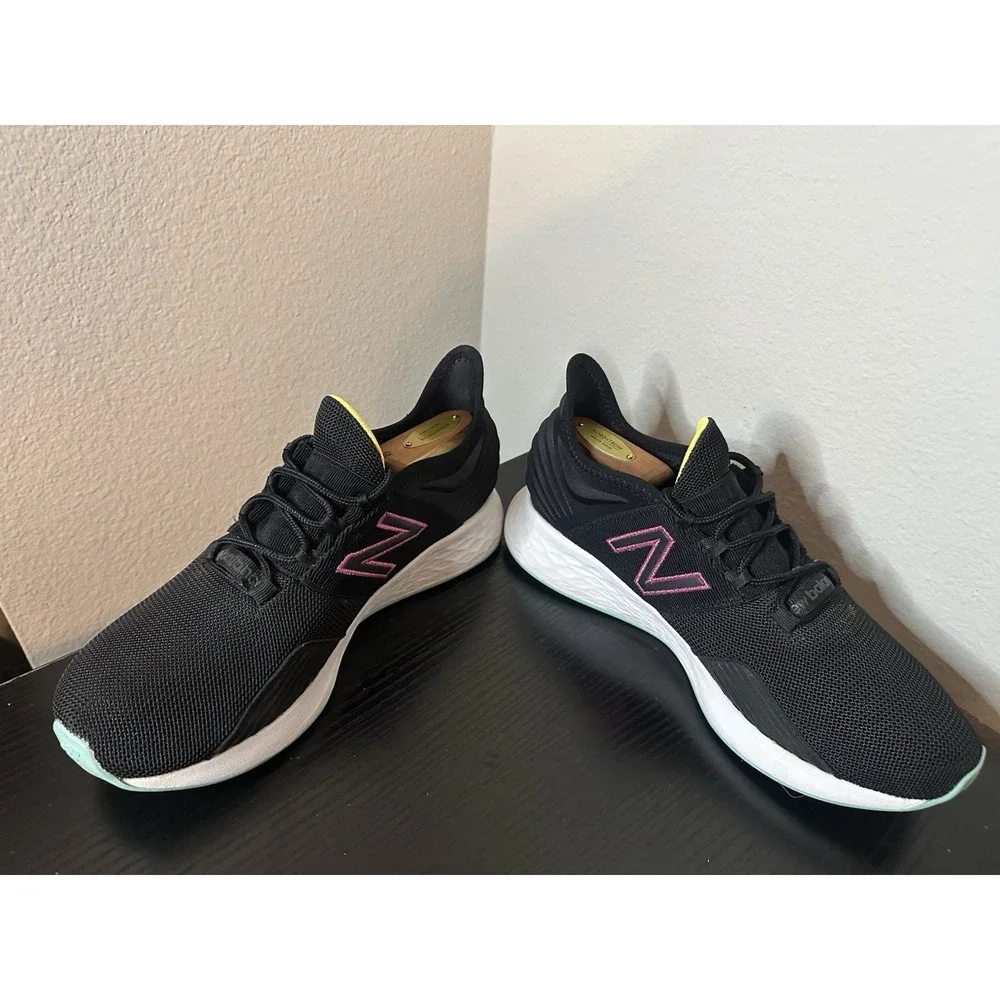 New Balance Black Athletic Sneakers with Pink and Yellow Accents